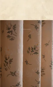 Close-up of vintage floral linen curtain with 50% blackout texture in warm cream