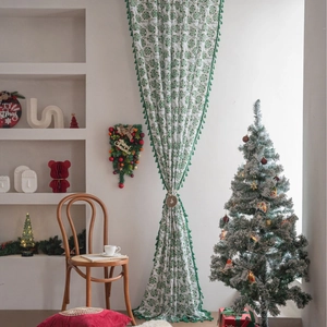 Festive green holly leaf print semi-blackout kitchen curtain with pom-pom fringe