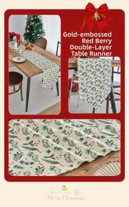 Macro detail of Christmas table runner showing gold stamping and berry leaf patterns