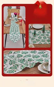 Close-up of Christmas table runner featuring gold foil snowflakes on green fabric detail