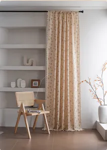 Detailed view of the vintage floral curtain with elegant white tassel fringe edges