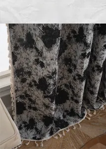 Detail of floral jacquard curtain fabric with chic black and white graffiti patterns