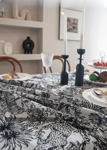 Close-up of heat-resistant black and white jacquard floral tablecloth fabric
