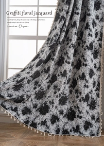 Detail of jacquard curtains featuring relief floral patterns and elegant side fringe tassels
