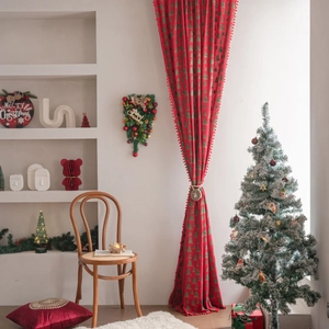 Red Christmas window curtain with green tree prints and decorative pom-pom edges