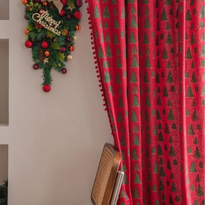 Red Christmas curtain featuring green tree patterns and decorative plush ball fringes