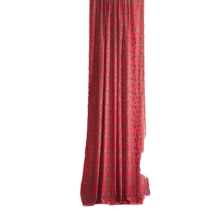 Red Christmas curtain with green tree patterns and decorative red pompom tassels
