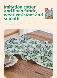 Detail of green floral linen-like table runner with gold accents and high-density texture