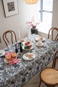 Detail of black and white toile de jouy floral tablecloth with high-quality jacquard fabric