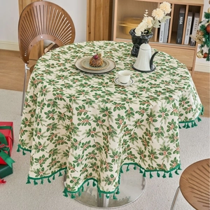 Round Christmas tablecloth with pine branch pattern and green tassels for festive dining