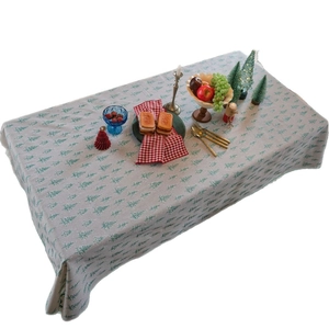 Light grey Christmas tablecloth with green pine tree prints for holiday dining tables
