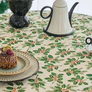 Christmas pine needle and berry print tablecloth in cream cotton linen for round tables