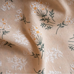 Floral print curtains in beige fabric with white and orange flowers for home decor