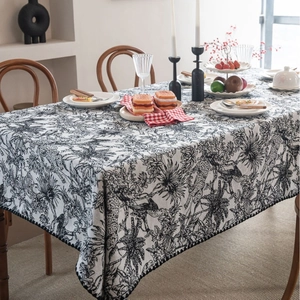 Elegant rectangular black and white Toile de Jouy tablecloth featuring jungle and leopard motifs