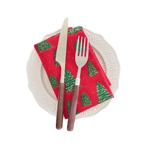 French country style Christmas napkin with green leaf print and wood handle cutlery set