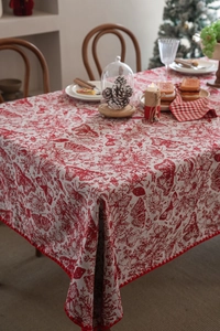 Close-up of red and white jacquard tablecloth with butterfly pattern and scalloped edges