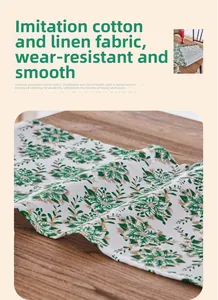 Macro detail of green floral table runner fabric with breathable texture and gold stamping
