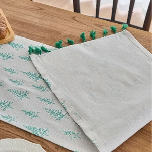 Gray Christmas table runner with green pine tree prints and tassel fringe decor