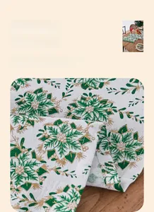 Detail of Christmas table runner with green poinsettia print and gold stamping foil