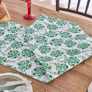 Elegant Christmas table runner with green poinsettia gold foil pattern on beige fabric