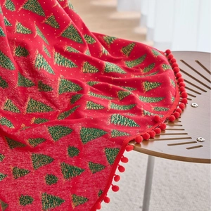 Red Christmas tablecloth with green pine tree prints and decorative red pom-pom fringe