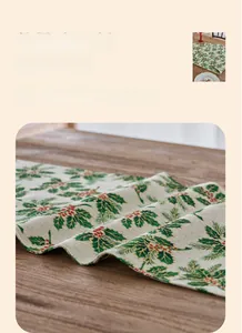 Detailed close-up of Christmas holly leaf pattern on cotton-linen texture table runner
