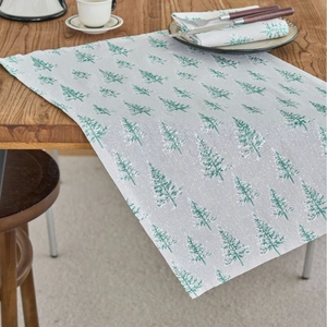 French country style table runner with green maple leaf print and snowy winter tree pattern