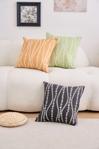 Detail of floral stripe pattern on square ginger, green and black cotton pillow covers
