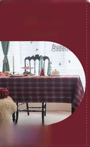 Detail shot of thick red and green checkered festive tablecloth for Christmas dining table