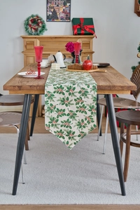 Detail of Christmas table runner with holly berry print and pointed corner design