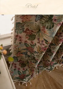 Macro shot of jacquard curtains with bird and flower patterns and cream fringe details