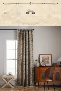 Detail of blue-gray jacquard curtain showing vintage floral pattern and handmade tassel fringe