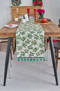 Detailed Christmas table runner featuring green holly leaves, red berries, and green tassels