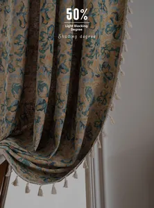 Detail of vintage floral jacquard curtain with elegant white tassels and 50% shading degree