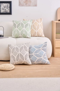 Detail view of modern geometric cushion covers in green, yellow, grey and blue fabrics