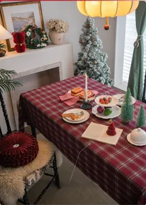 Detailed close-up of thick red and white checkered Christmas tablecloth with fringe