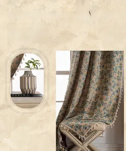 Detailed close-up of floral embroidery on polyester curtain with cream tassel edge trim