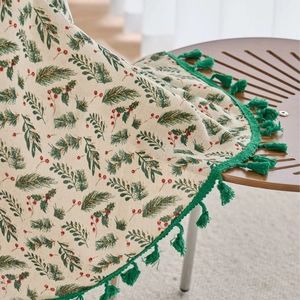 Christmas pine needle tablecloth with red berries and festive green tassel fringe