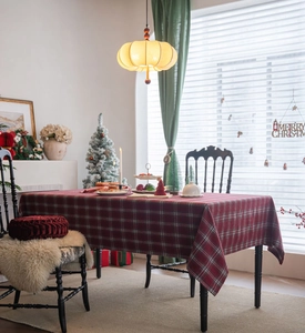 Close-up of thick red and green plaid tablecloth with classic Christmas holiday pattern