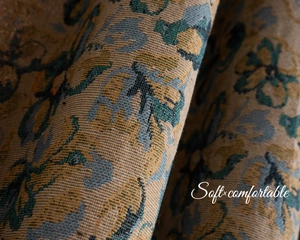 Detailed macro shot of vintage floral jacquard fabric showing intricate woven texture