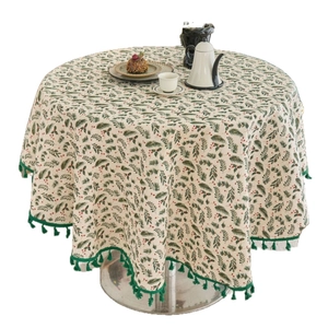 Round Christmas tablecloth with pine needles and red berries print and green tassels
