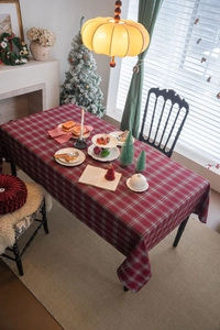Close-up of red plaid tablecloth with classic tartan pattern for Christmas dining decor