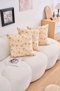 Three-piece floral pillowcase set in cream fabric for a modern cottage style home sofa