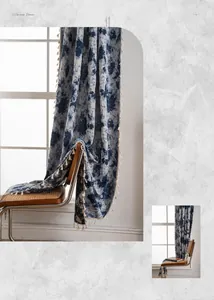 Close-up of thick American vintage curtains with blue graffiti floral patterns and tassels