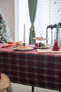 Detail of thick red plaid tablecloth with festive Scottish tartan pattern for Christmas