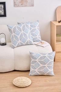 Detail of blue and white geometric leaf pattern on cotton linen decorative pillowcases