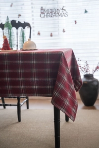 Close-up of thick red and green plaid tablecloth with classic Scottish check texture