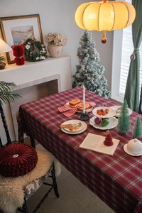 Close-up of a festive red and white checkered tablecloth for Christmas table decoration