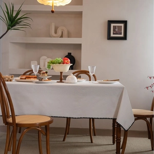 White linen tablecloth with black wavy embroidery for elegant home dining decor