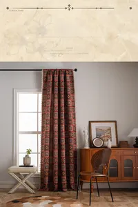 Detail of red geometric jacquard curtain fabric with cream handmade tassel trim edges
